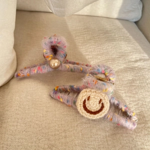 Plush purple knit hair claw clips set with cute smiley face and pearl accents
