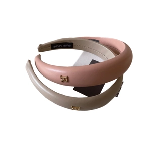 Retro faux leather headbands in pink and beige with gold metal letter R logo detail