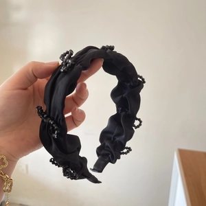 Elegant black pleated headband with black crystal beads for a high cranium look