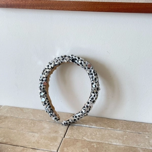 Sequin tweed headband with black and white woven pattern and silver decorative elements