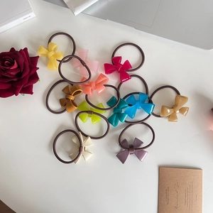 Set of 11 colorful bow hair ties with elastic bands and glossy resin finishes