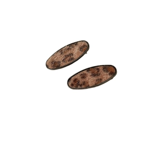 Pair of retro leopard print oval hair clips with fuzzy texture and black metal frames