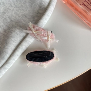 Pink plush hair clips with white ribbon bows in a stylish two-piece set for women