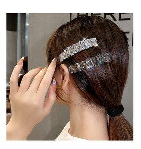 Detail of silver and dark grey rectangular hairpins with full rhinestone inlay and metal base