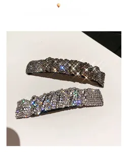 Close-up of sparkling rhinestone hair clips in gunmetal and silver finishes