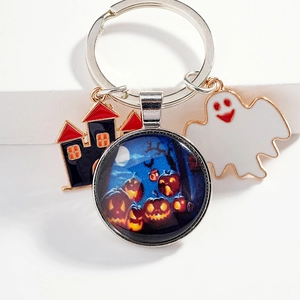 Halloween keychain with cartoon ghost castle and pumpkin glass pendant on white background