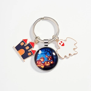 Halloween charm keychain with enamel ghost, haunted castle and pumpkin glass cabochon