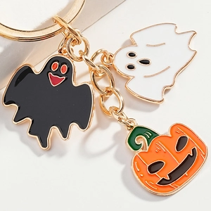 Halloween keychain with cute ghost and pumpkin enamel charms on a gold metal chain