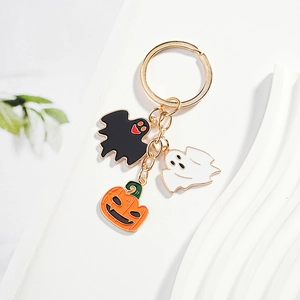 Halloween keychain with enamel ghost, pumpkin and bat charms on golden ring