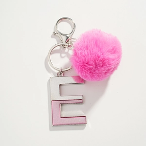 Pink plush pom-pom and glittery metal letter E keychain for stylish bags and keys