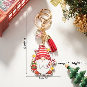 Christmas gnome keychain with red tassel and gold star charm for holiday bag decoration