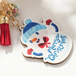 Blue Christmas snowman wooden keychain with red tassel and star-filled glass ball charm