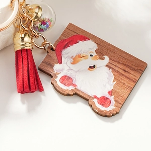 Cute winking Santa Claus wooden keychain with red leather tassel and festive star charm