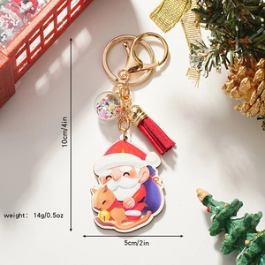 Cartoon Santa Claus wooden keychain with red tassel and acrylic pendant on festive background