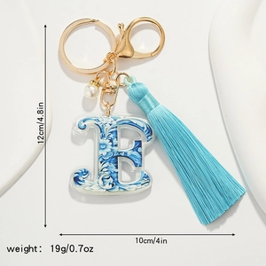 Blue and white porcelain style letter E keychain with tassel and pearl charm