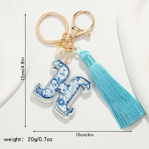 Blue floral porcelain style letter H keychain with tassel and size specifications