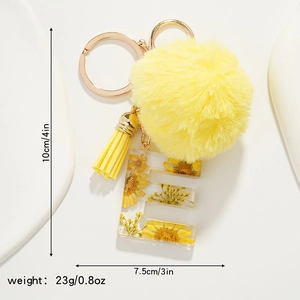 Detailed dimensions of yellow daisy resin letter E keychain with pom pom and tassel