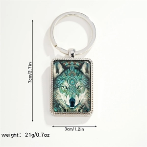 Detail view of rectangular wolf pendant keychain with measurements 7cm by 3cm