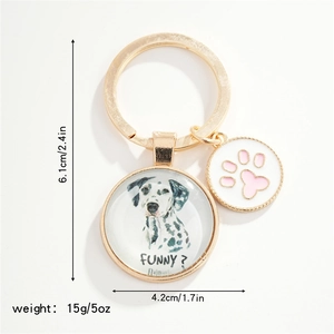 Golden puppy keychain with marble dalmatian round pendant and pink paw charm accessory