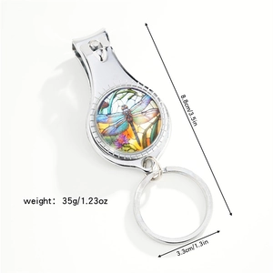 Detail view of dragonfly keychain nail clipper with dimensions 8.8cm and 35g weight