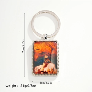 Detailed view of western cowboy keychain with dimensions 7x3cm and sunset horse rider design