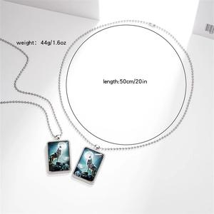 Detail view of double wolf pendant necklace showing 50cm bead chain length and 44g weight