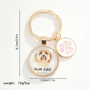 Detail view of golden Poodle charm keychain showing size and weight specifications