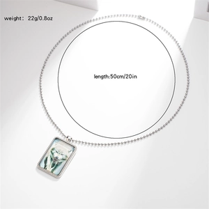 Detail view of wild wolf pendant necklace with length and weight specifications