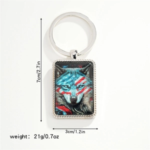Detailed view of rectangle metal wolf keychain with flag pattern and dimension markings