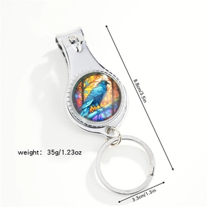 Dragonfly nail clipper keychain with dimensions 8.8cm by 3.3cm on white background