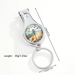 Detail showing multifunctional silver dragonfly nail clipper with size measurements
