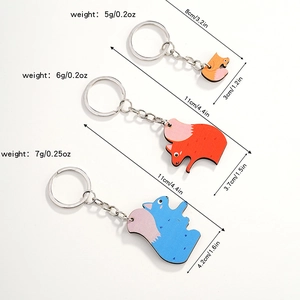 Detailed view of three squirrel puzzle keychains with measurements and weight specifications