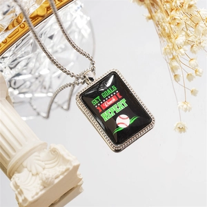 Macro detail of rectangle baseball pendant with Set Goals motivational text on chain