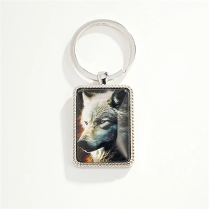 Silver rectangle keychain featuring a wolf head portrait with a glass dome cover