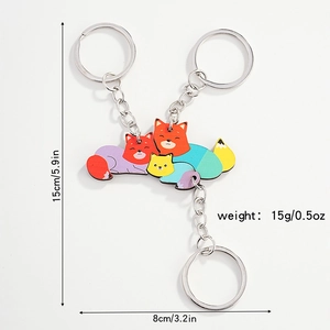 Detailed size and weight specs for a set of three colorful wooden fox keychains