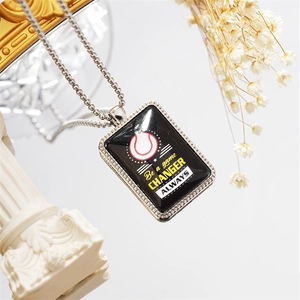Macro shot of rectangular baseball pendant necklace with Be a game CHANGER text