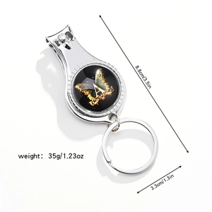 Detailed view of silver stainless steel 3-in-1 nail clipper keychain with butterfly letter A