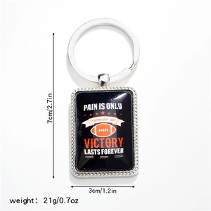 Detail of rugby keychain pendant showing 7cm height, 3cm width and 21g weight measurements
