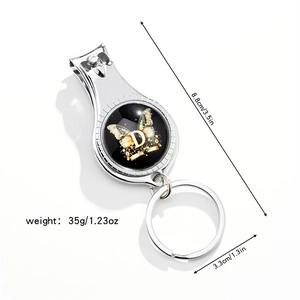 Compact 3-in-1 metal nail clipper and bottle opener with stylish letter D butterfly design