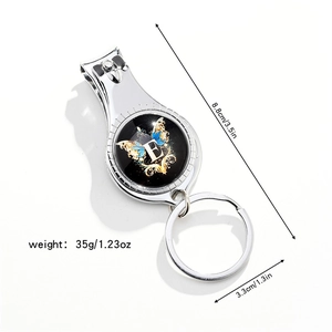 Close-up of 3-in-1 multi-tool keychain with size measurements and floral letter E design