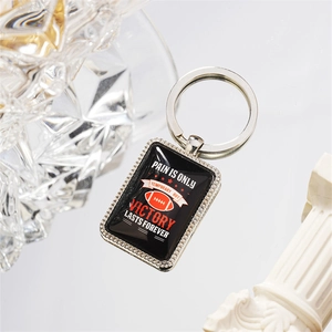 Rugged stainless steel American football keychain with inspirational victory quote