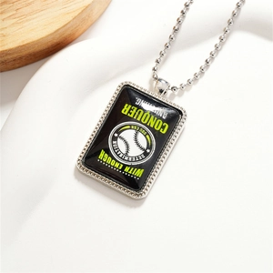 Inspirational baseball pendant necklace with Conquer text and ball chain on a white base