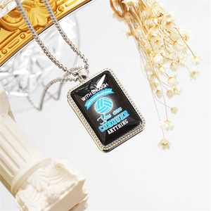 Detail of volleyball pendant with motivational text on silver bead chain for athletes
