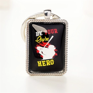 Porte-clés de baseball avec silhouette d'athlète et texte inspirant Be Your Own Hero