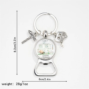 Close-up of Happy Camper keychain bottle opener with vintage camper glass dome art