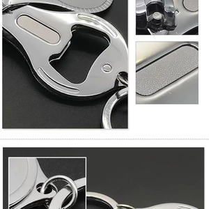 Close-up of portable stainless steel nail clipper with integrated bottle opener and keyring