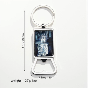 Detail view of silver metal bottle opener keychain with cat and tiger art dimensions