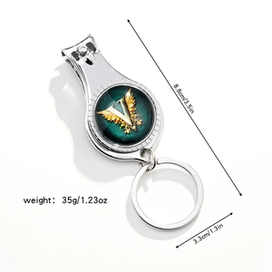 Close-up of silver metal 3-in-1 nail clipper keychain with dimensions 8.8x3.3cm