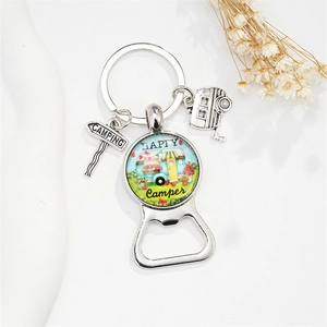 Detail of happy camper keychain with silver caravan charm and bottle opener feature
