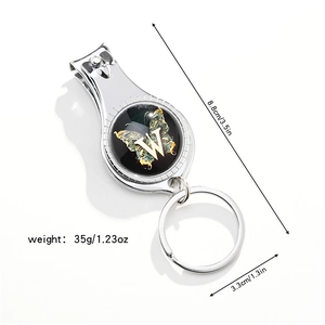 Silver 3-in-1 bottle opener nail clipper keychain with butterfly and letter W design